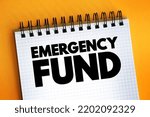 Small photo of Emergency fund - personal budget set aside as a financial safety net for future mishaps or unexpected expenses, text on notepad