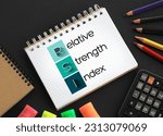 RSI - Relative Strength Index acronym on notepad, business concept background