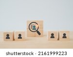 Small photo of wooden cube blocks with buyer information in magnifying glass ,buyer persona and target customer concept, Customer psychology profile or characteristics, Marketing analysis for business plan