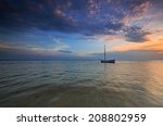 Lonely Boat At Sea At Dusk