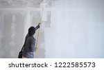 the  technician painting white... | Shutterstock . vector #1222585573