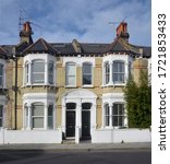 Small photo of LONDON - MARCH 21, 2020. Nineteenth century Victorian period terraced brickwork houses in the Fulham district of south west London, UK.