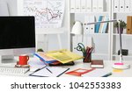 office desk a stack of computer ... | Shutterstock . vector #1042553383