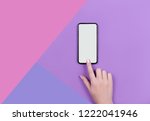 Kyiv Ukraine 2018 10 19. Top view of a woman hand using smart phone on lilac background.