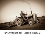 Farmer In Old Fashioned Tractor ...