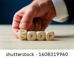 Businessman turning a dice with words yes and no in front of a P2P sign in conceptual image of financial investment.