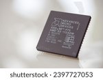 Small photo of Timisoara, Romania - July 23, 2020: Close-up of an AMD AM5x86-P75 processor, 133 MHz, socket 3 isolated on white background