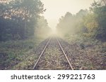 Railway tracks in misty day