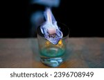 Small photo of Preparing absinth with sugar and fire