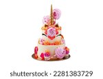 Tall and bright unicorn cake with chocolate, meringue swirls and cupcakes. Isolated on white background with copy space on a side. Horizontal