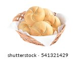 Bread rolls in basket isolated on white background 