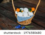 White Eggs In A Basket On A...