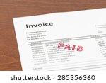 invoice with paid stamp ... | Shutterstock . vector #285356360