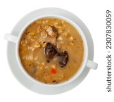 Small photo of Delicious thick rustic style pearl barley mushroom soup with pork meat and vegetables served in tureen. Isolated over white background