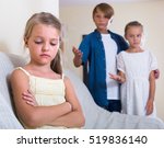 Small photo of Offended little girl is jealous sister of stepbrother indoors