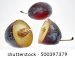 Small photo of whole and halved plums to indemnify.