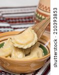 Small photo of Cooked traditional Ukrainian hand-made varenyky (dumplings, pierogi ruskie in Poland) with cottage cheese in a bowl