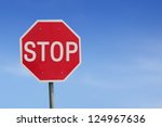 Stop sign blue sky background. Thailand Language.