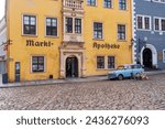 Small photo of Misnia, Germany - Mar 1, 2024: Colorful buildings along the street of Meissen. The southern frontage of the Market Square. Saxony, Europe.