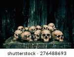 Pile of human skulls on stone...
