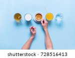 Female Hands Holds Group Useful Colorful Beverages Drink Coffee Milk Tea Orange Juice Water Flat Lay Still Life Table Top View Blue Background