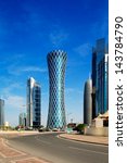 Small photo of DOHA, QATAR - JUN 17: 200 m tall "Tornado Tower" of the West Bay on Jun 17, 2013 in Doha. The hyperbolic shape of the tower is intended to represent a desert whirlwind, hence the name "Tornado Tower"