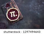 Pi Day Cherry Pie - making homemade traditional Cherry Pie with Pi sign for March 14th holiday, on rustic background, top view, copy space.