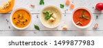 Soup Assortment. Set of various seasonal vegetable soups and organic ingredients, banner, copy space. Homemade colorful vegan vegetarian soups.