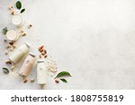 Small photo of Vegan plant based milk and ingredients, top view, copy space. Various dairy free, lactose free nut and grains milk, substitute drink, healthy eating.
