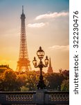 Small photo of Street lantern on the Alexandre III Bridge against the Eiffel Tower in Paris, France