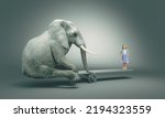 Small photo of Little girl balancing on a plank with a big elephant