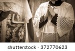 Small photo of Artistic vintage sepia edit of an altar boy or a mass server in surplice during the traditional tridentine latin catholic mass