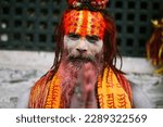 Small photo of KATHMANDU - JULY 22: Sadhu at Pashupatinath Temple in Kathmandu, Nepal on July 22, 2013. Sadhus are holy men who have chosen to live an ascetic life and focus on the spiritual practice of Hinduism