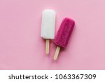 pink and white summer ice lollies on a pink background