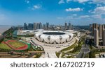 Small photo of Hangzhou, China - August 20, 2020: Aerial view of Hangzhou Olympic Sports Center Gymnasium. The stadium covers an area of 430 acres. Hangzhou Asian Games will be held here in 2022.