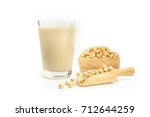 Soy milk with soybeans isolated on white background. 