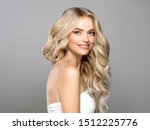 Beautiful blonde hair woman long curly hairstyle healthy skin natural makeup