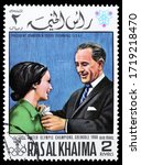 Small photo of RAS AL KHAIMA - CIRCA 1968 : Cancelled postage stamp printed by Ras Al Khaima, that shows President Johnson and Peggy Flemming, circa 1968.