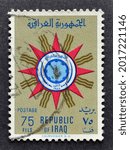 Small photo of IRAQ - CIRCA 1959 : Cancelled postage stamp printed by Iraq, that shows State Emblem of Republic of Iraq, circa 1959.