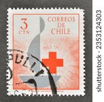 Small photo of Chile - circa 1963 : Cancelled postage stamp printed by Chile, that shows Centenary emblem, 100 Years Red Cross; circa 1963.