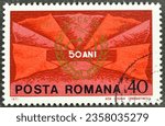Small photo of Romania - circa 1971 ; Cancelled postage stamp printed by Romania, that shows Red Flags and Communist Party Badge, 50th Anniversary of Romanian Communist Party, circa 1971.