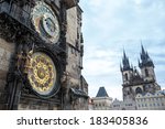 Astronomical clock of in Old Town of Prague with Tyn church at the background 
