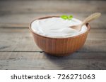 Greek yogurt in a wooden bowl...