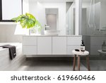 stock-photo-luxury-white-family-bathroom-styled-with-greenery-and-a-wooden-s-619660466.jpg