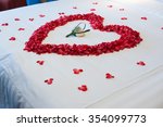 Honeymoon, Wedding bed topped with rose petals
