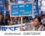 Small photo of London, UK. 11th March 2023. Protesters at the SOS NHS National Demo in central London, supporting striking healthcare workers and in protest of the crisis caused by government cuts and mismanagement