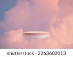 Small photo of surreal modern wood podium outdoor on blue sky pink gold pastel cloud with space.Beauty cosmetic product placement pedestal present promotion minimal display,spring or summer paradise dream concept.