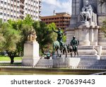 The stone sculpture of Miguel de Cervantes and bronze sculptures of Don Quixote and Sancho Panza on the Square of Spain (Plaza de Espana) in summer. Madrid is a popular tourist destination of Europe.