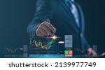 Small photo of planning analyze indicator and strategy buy and sell, Stock market, Business growth, progress or success concept. Businessman or trader is pointing a growing virtual hologram stock, invest in trading