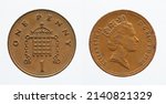 Small photo of UNITED KINGDOM - CIRCA 1986: One penny coin from United Kingdom showing a portrait of Queen Elizabeth II and a crowned portcullis with chains above the denomination "1"